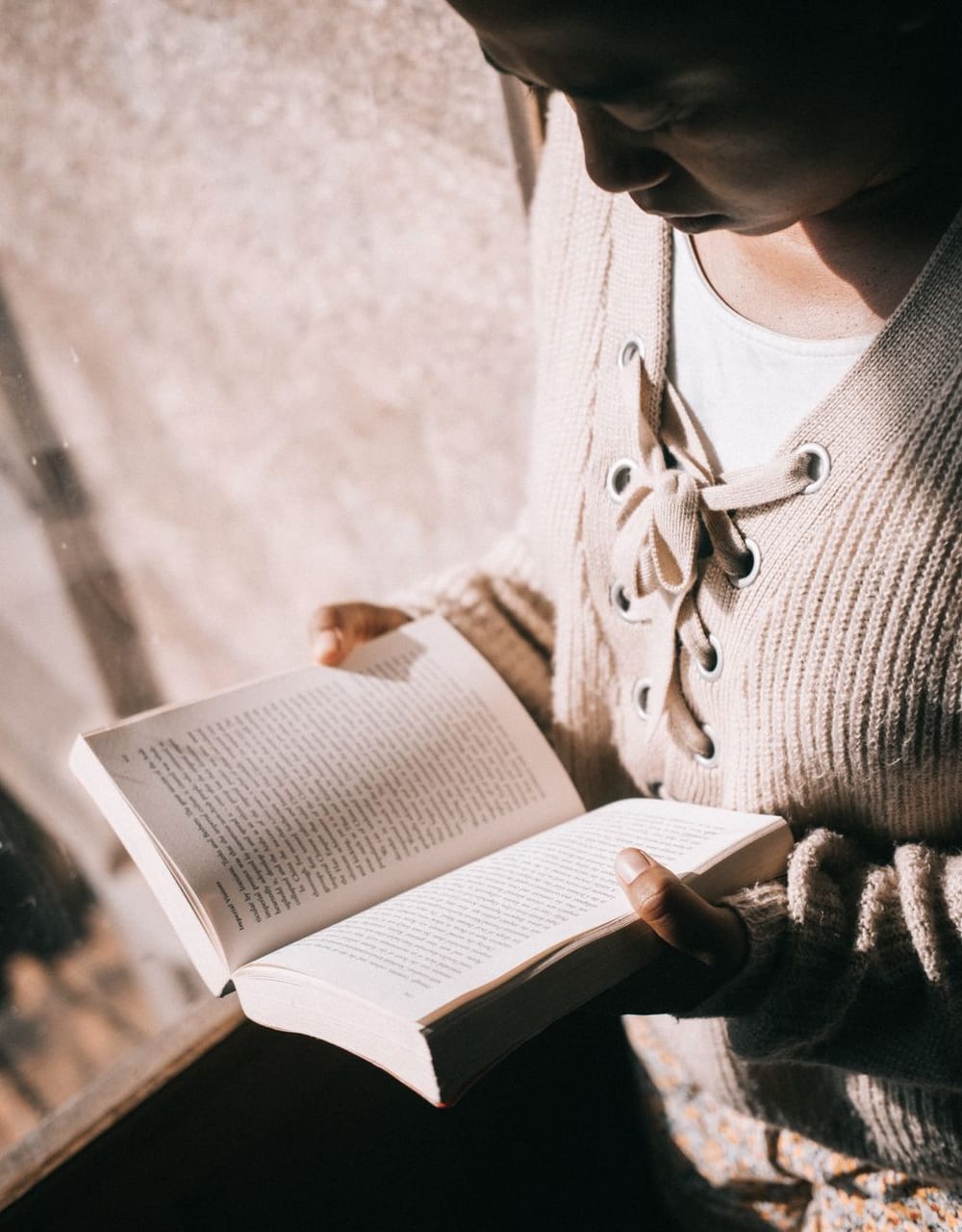 Hands and an open book, close