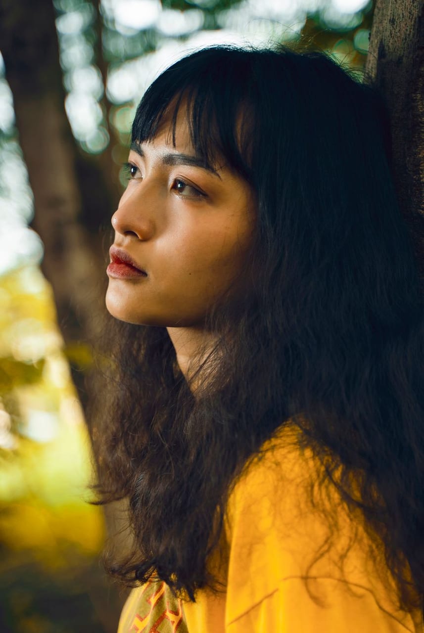 A woman in profile, warm tones