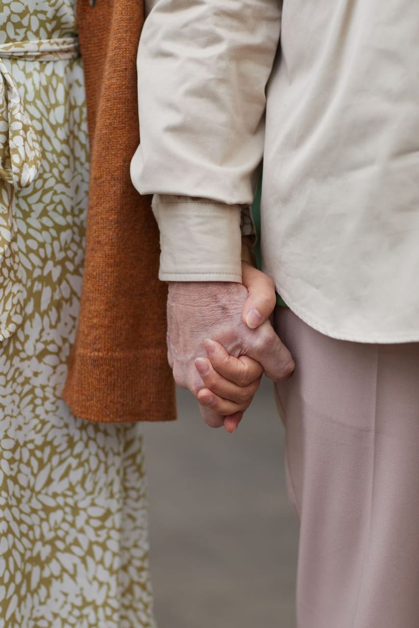 An older couple's hands, holding